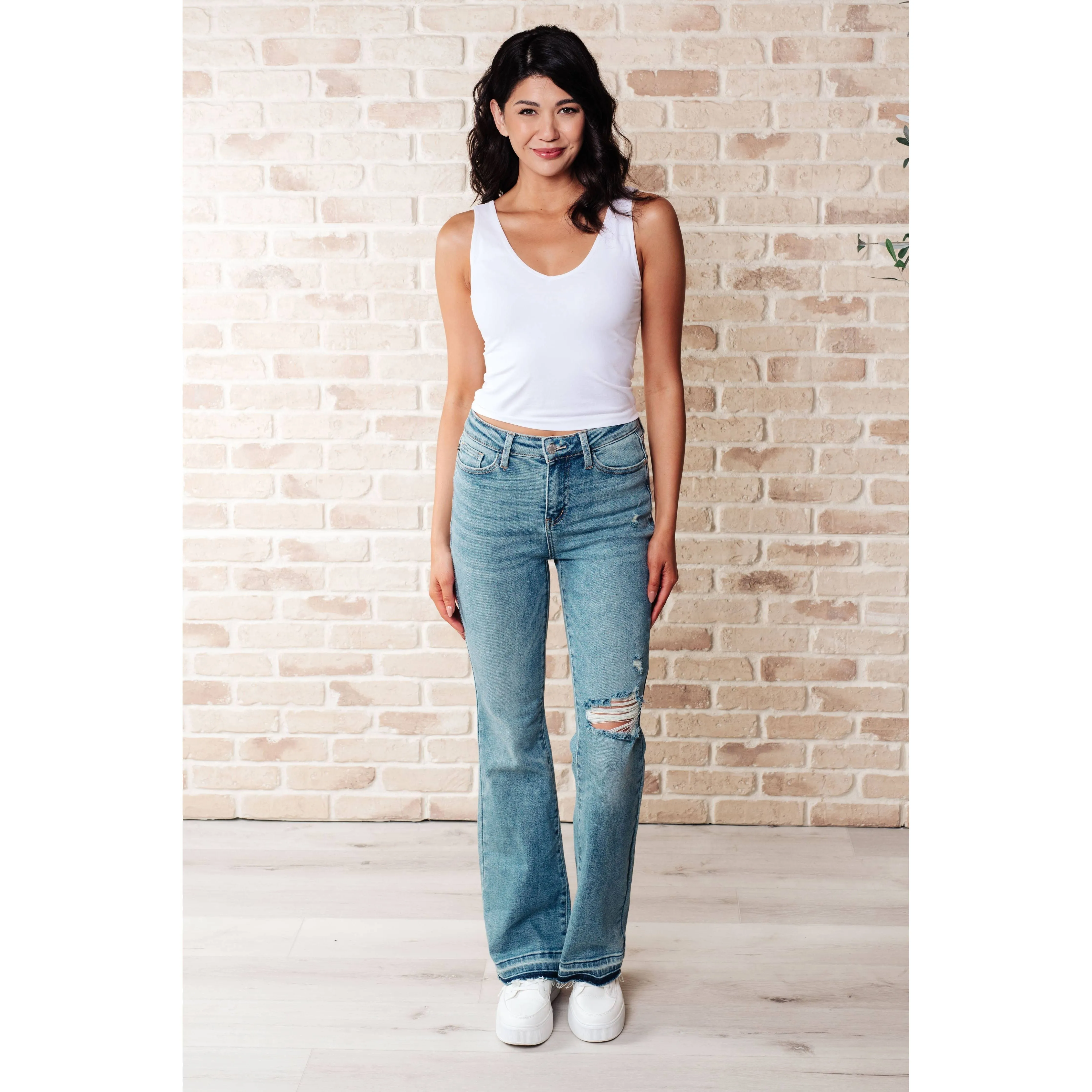 Judy Blue Mid Rise Distressed Released Hem Bootcut Jeans: 7/28
